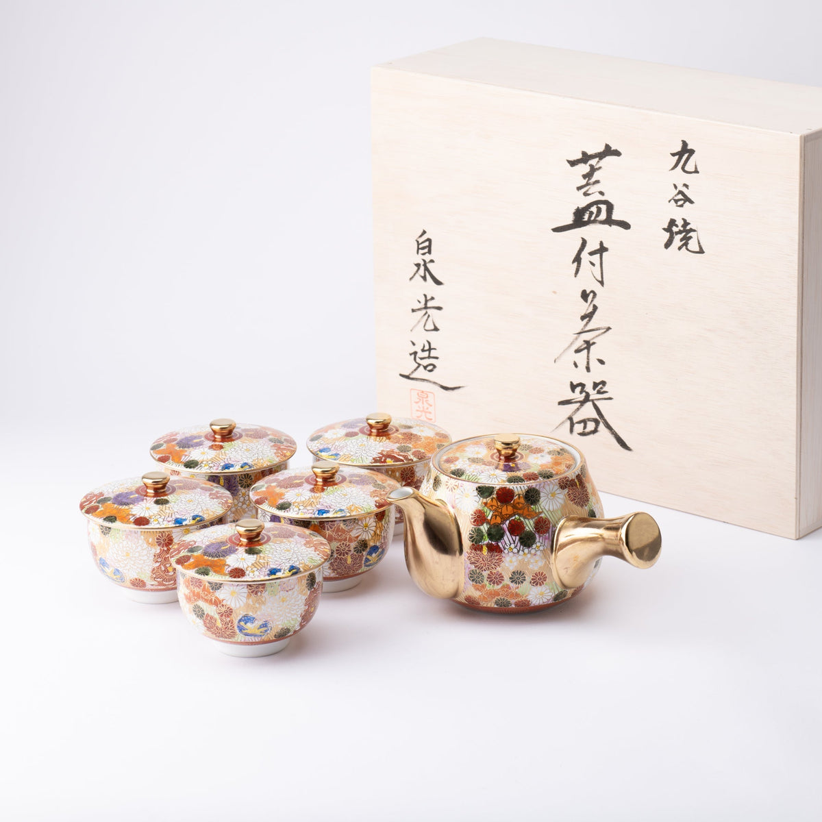 http://kutaniware.com/cdn/shop/products/hanazume-kutani-japanese-teapot-set-5-cups-musubi-kiln-handmade-japanese-tableware-and-japanese-dinnerware-384813_1200x1200.jpg?v=1685579073