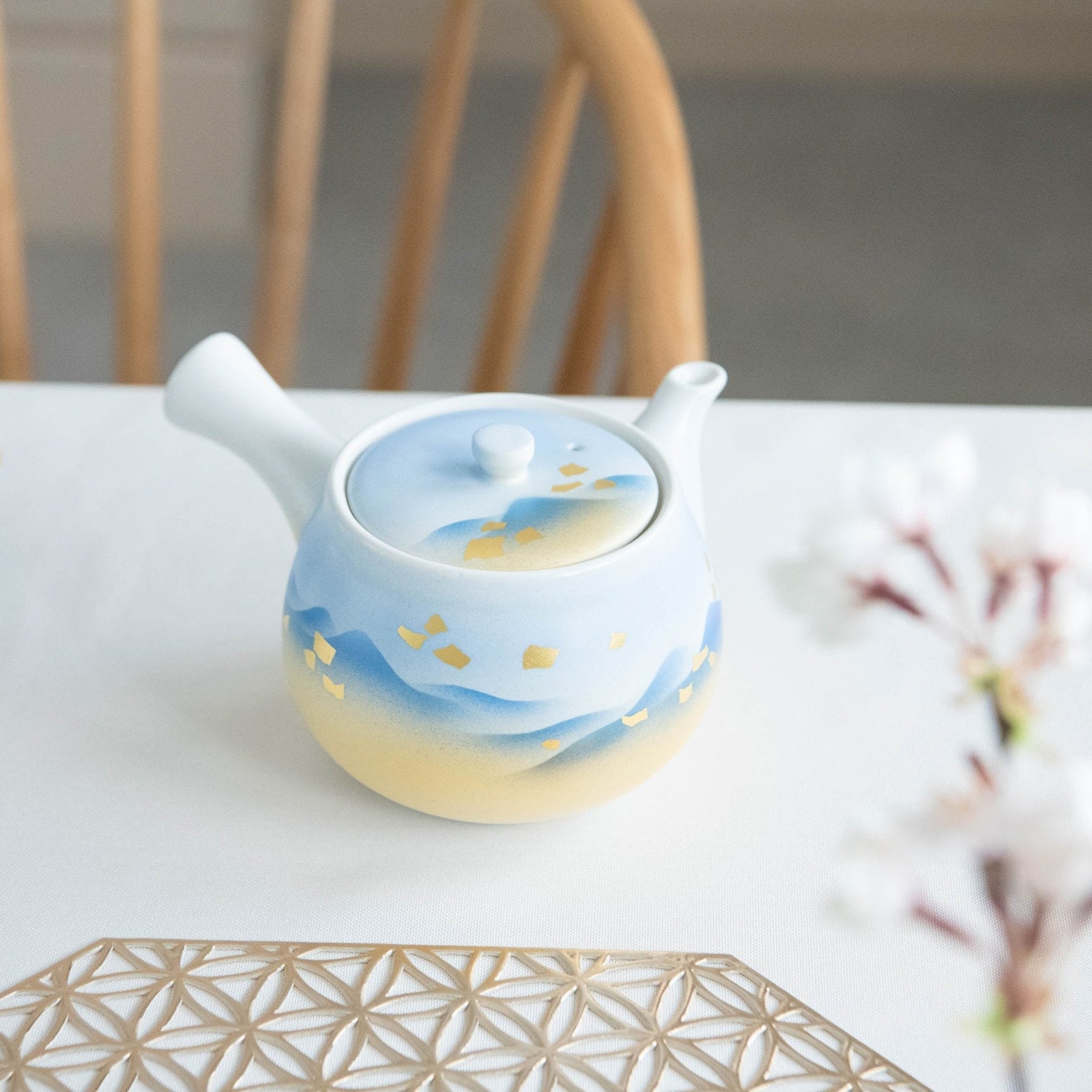 https://kutaniware.com/cdn/shop/products/blue-mountains-kutani-japanese-teapot-set-musubi-kiln-handmade-japanese-tableware-and-japanese-dinnerware-272082_1800x1800.jpg?v=1685579065